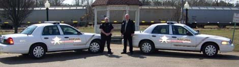 Foreman police officers with patrol cars